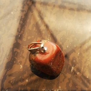 A Speckled Red Stone Pendant